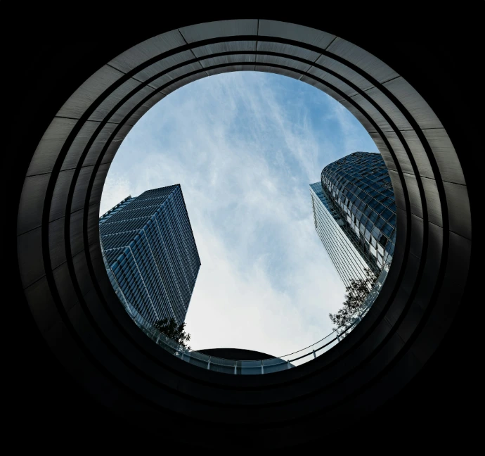 A view of a building through a circular window